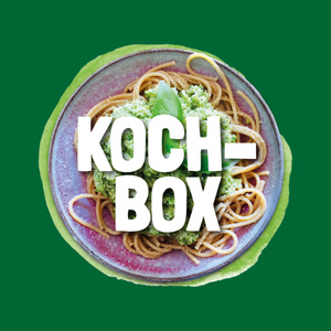 Ein Teller mit Spaghetti und grünem Pesto. Text: "KOCH-BOX".